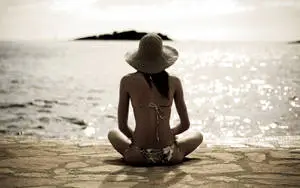 Bikini Girl Sitting On The Ground
