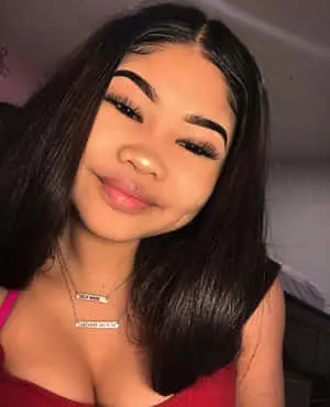 a young woman with long black hair posing for a photo