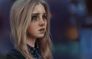 a girl with green eyes and blond hair