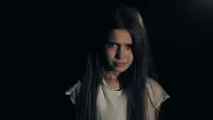 A girl shedding tears of sadness