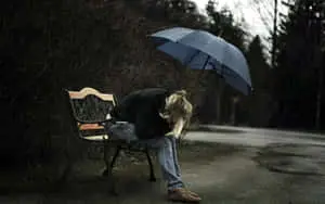 a woman sitting on a bench