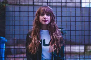 Curly Cute Girl In Fila Shirt