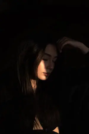  Caption: Elegant Dark-skinned Girl Illuminated by Sunlight 
