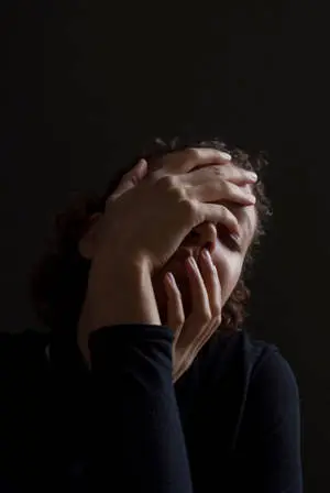 Dark Sad Woman Covering Face