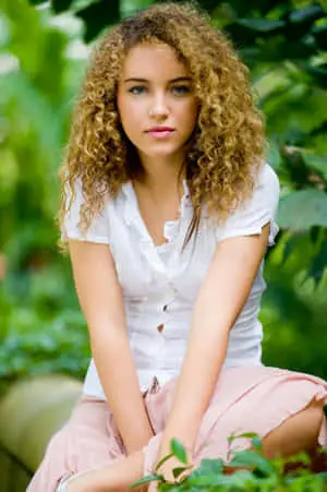 a young woman sitting on a bench