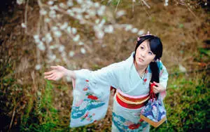 Japanese Girl Wearing Kimono In Forest