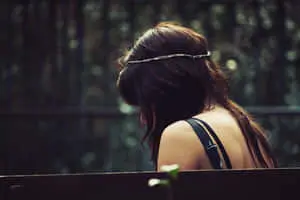 a woman sitting on a bench