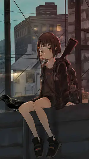 a girl sitting on a ledge with a gun