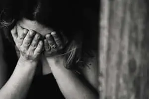 Sad Woman Covering Her Face Picture