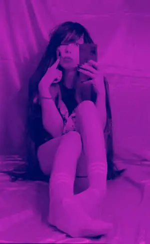 a girl is taking a selfie
